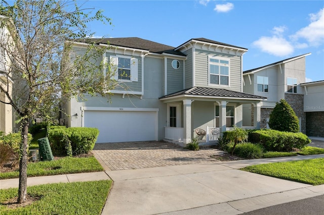 view of front of house with a garage and covered porch