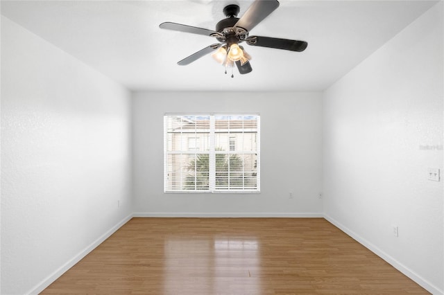 spare room featuring ceiling fan and hardwood / wood-style flooring