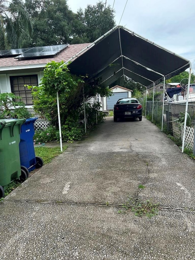 view of parking with a carport