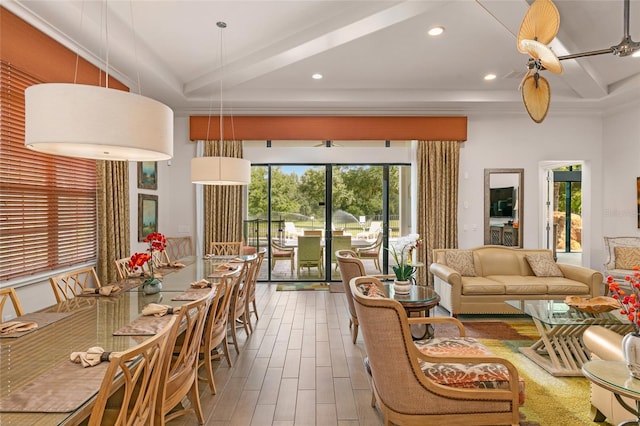 living room with beamed ceiling, wood-type flooring, and ceiling fan