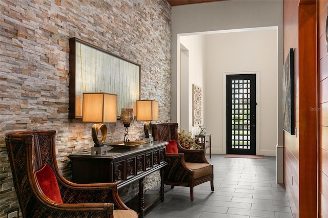 living area with tile patterned floors