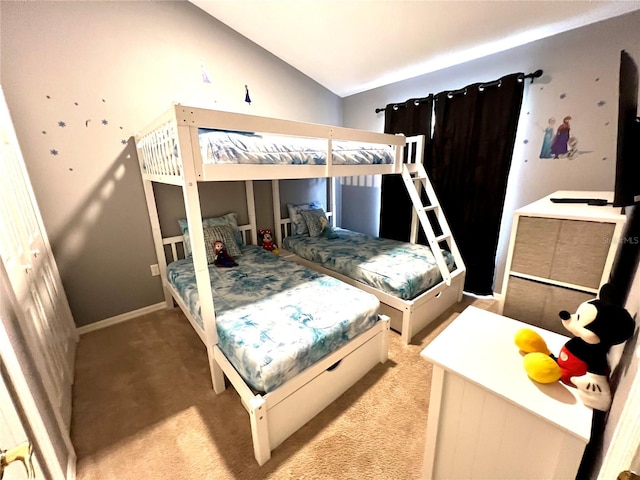 carpeted bedroom featuring lofted ceiling