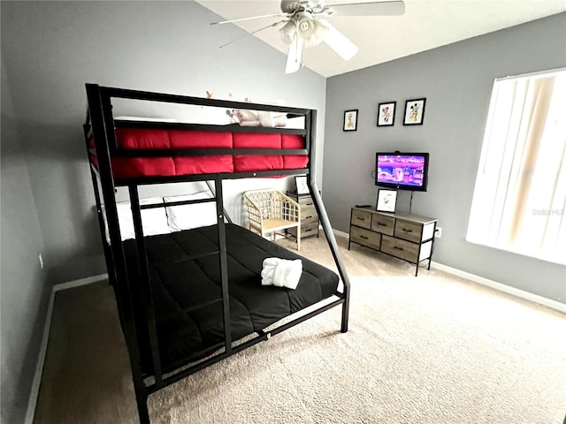 bedroom featuring lofted ceiling, ceiling fan, and carpet floors