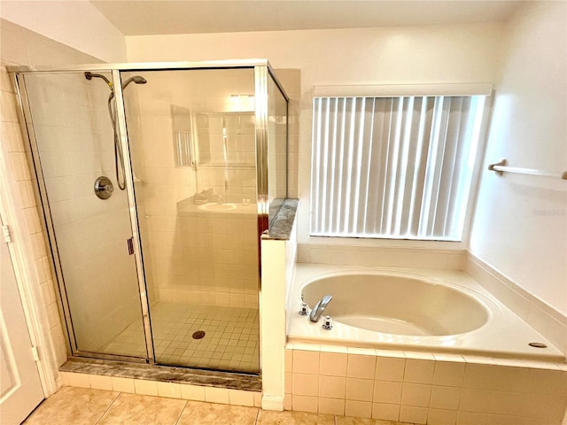 bathroom featuring independent shower and bath and tile patterned flooring