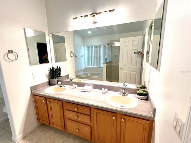 bathroom with independent shower and bath, vanity, and tile patterned floors