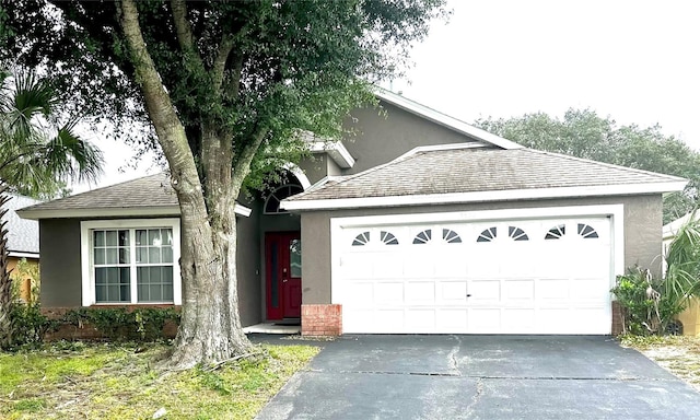 view of front of property with a garage