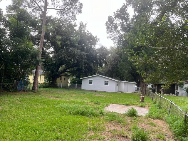 view of yard with a fenced backyard