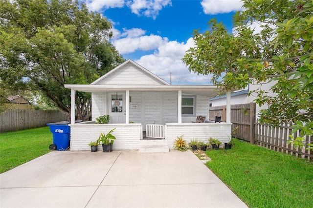 bungalow featuring a front yard and a porch