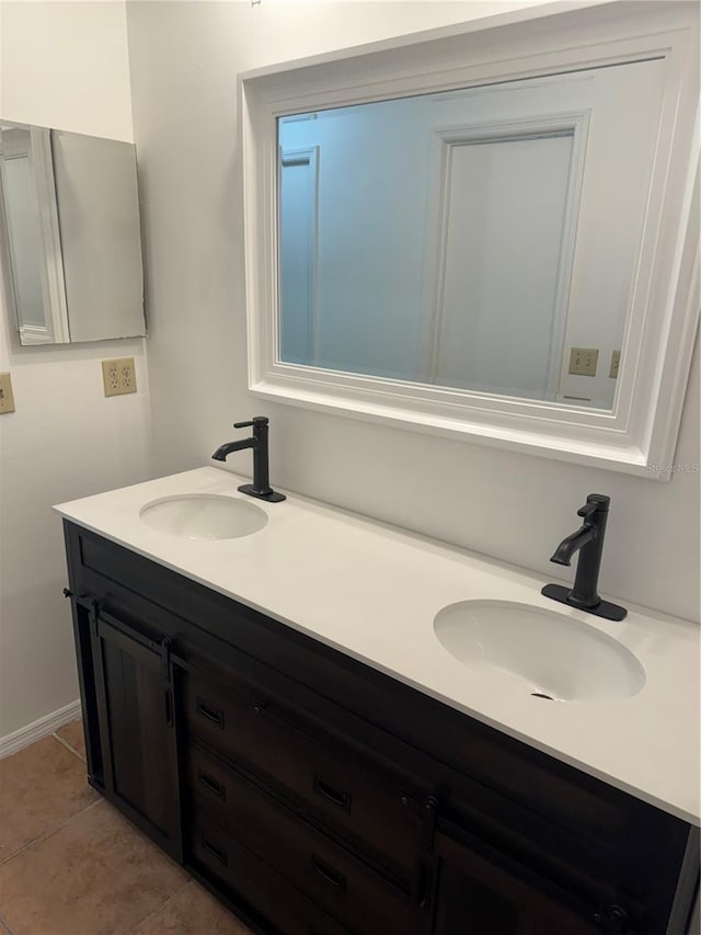 bathroom with vanity and tile patterned floors