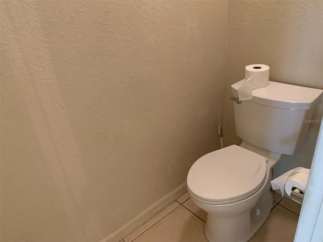 bathroom featuring toilet and tile patterned floors