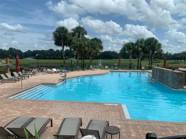 view of swimming pool with a patio