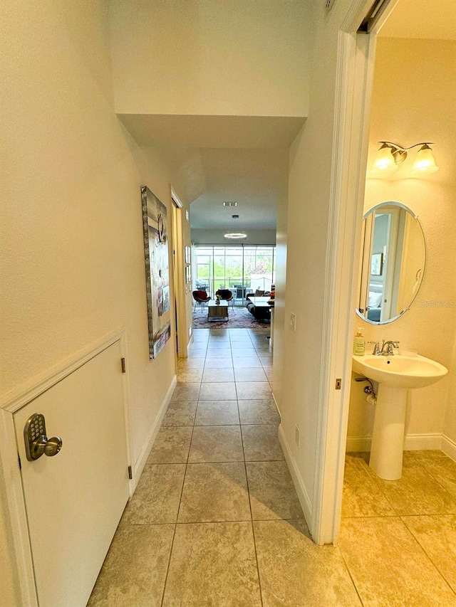 hallway featuring light tile patterned floors