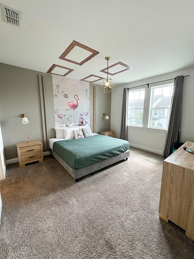 carpeted bedroom with a textured ceiling