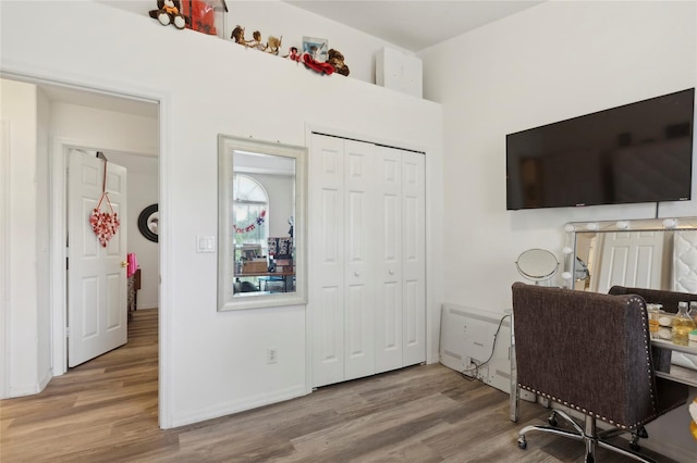 home office with wood-type flooring