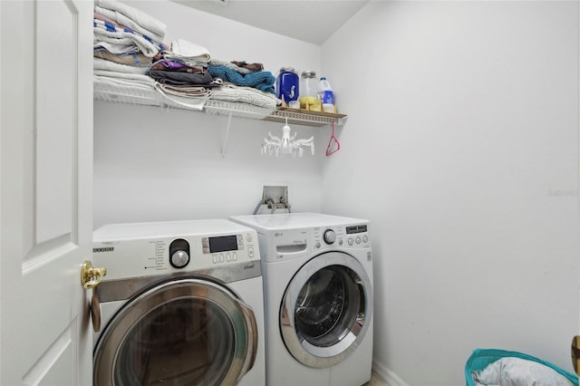 washroom featuring washing machine and dryer