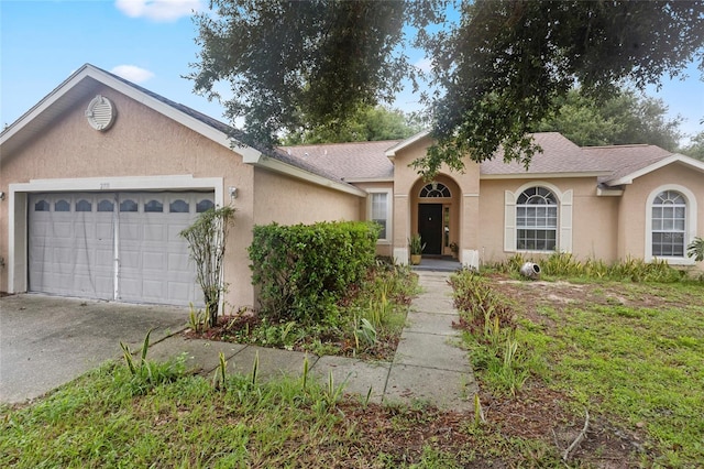 single story home featuring a garage