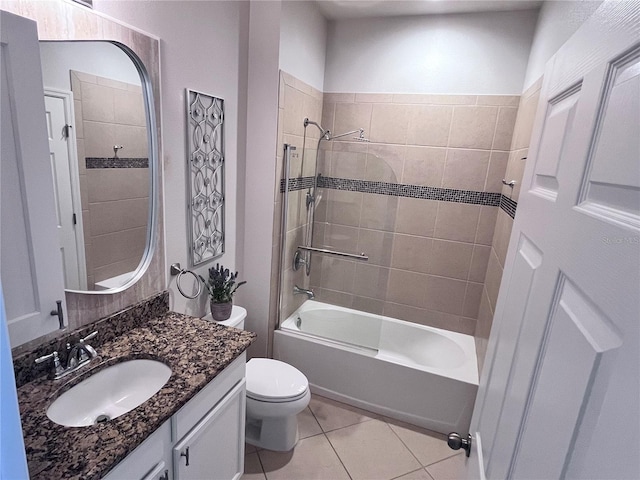 bathroom featuring toilet, tile patterned flooring, bathtub / shower combination, and vanity