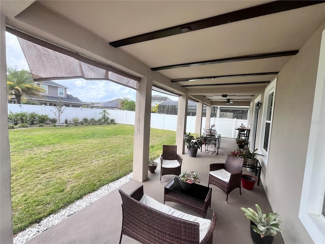 view of patio with outdoor lounge area, a fenced backyard, and a ceiling fan