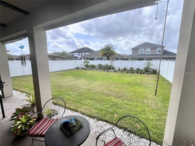 view of yard with a fenced backyard