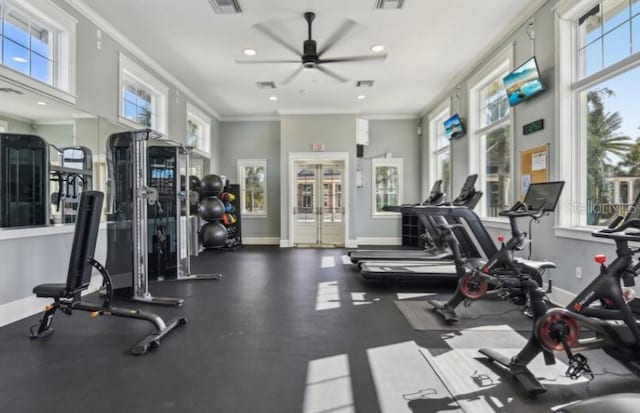 workout area with ornamental molding, recessed lighting, plenty of natural light, and baseboards