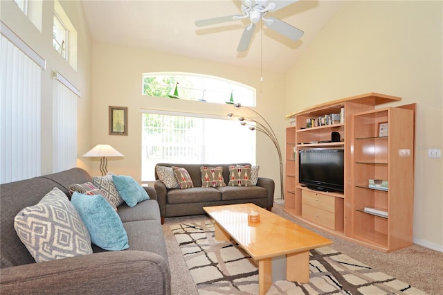 living room with ceiling fan, light carpet, and high vaulted ceiling