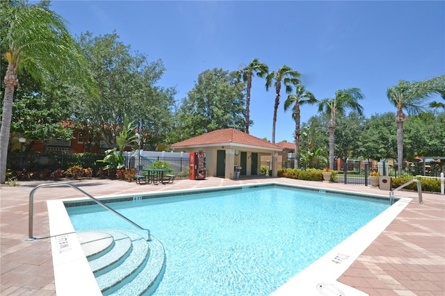 view of swimming pool featuring an outdoor structure