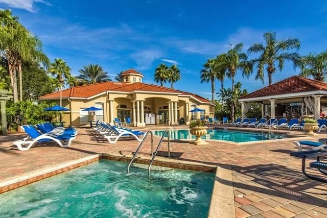 view of pool featuring a gazebo and a patio area