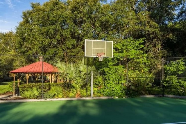 view of sport court with a gazebo