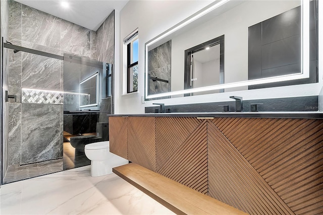 bathroom with vanity, toilet, and a tile shower