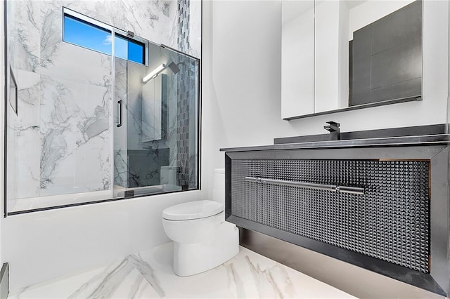 full bathroom with bath / shower combo with glass door, vanity, and toilet