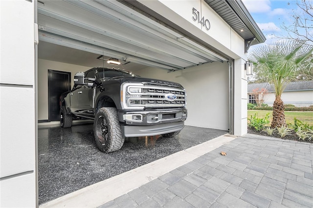 garage featuring a garage door opener