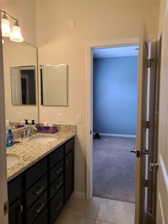 bathroom with tile patterned flooring and vanity