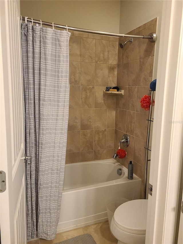 bathroom with toilet and shower / tub combo