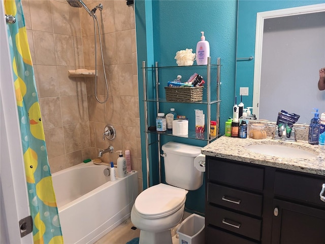 full bathroom featuring vanity, shower / bath combination with curtain, and toilet