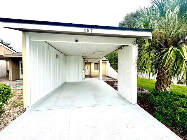 view of parking / parking lot with a carport