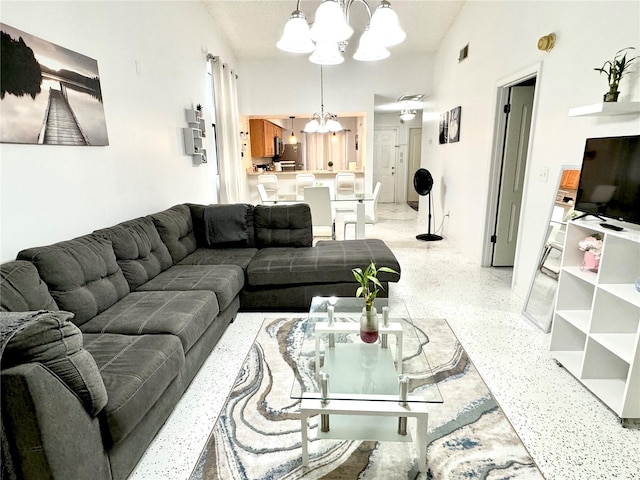 living room with a notable chandelier