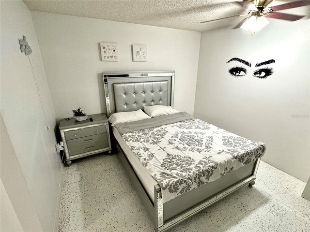 bedroom featuring a textured ceiling and ceiling fan