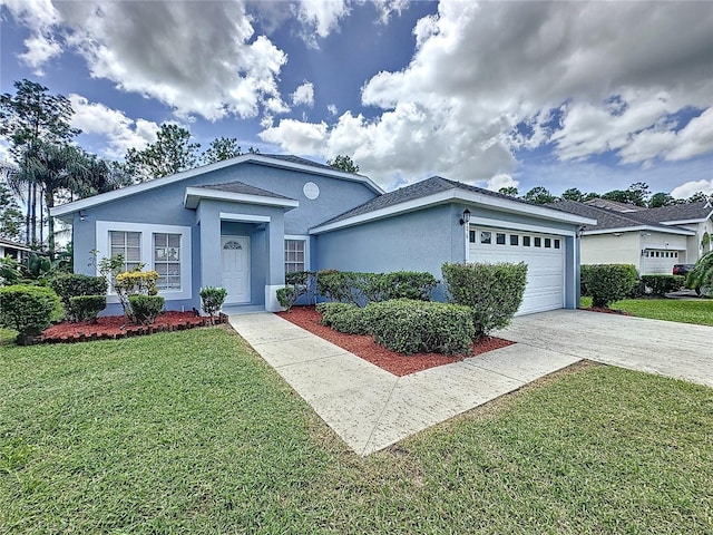 ranch-style house featuring a garage and a front lawn