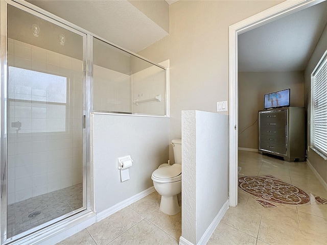 bathroom featuring tile patterned floors, vaulted ceiling, walk in shower, toilet, and a textured ceiling