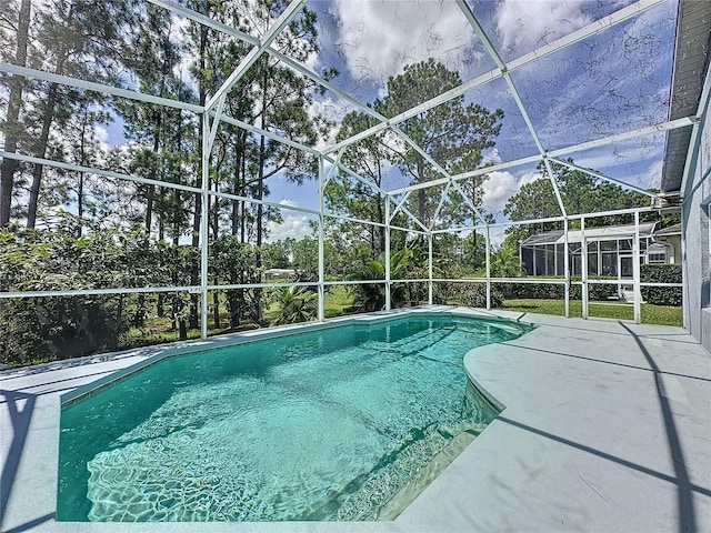 view of pool featuring a lanai and a patio area