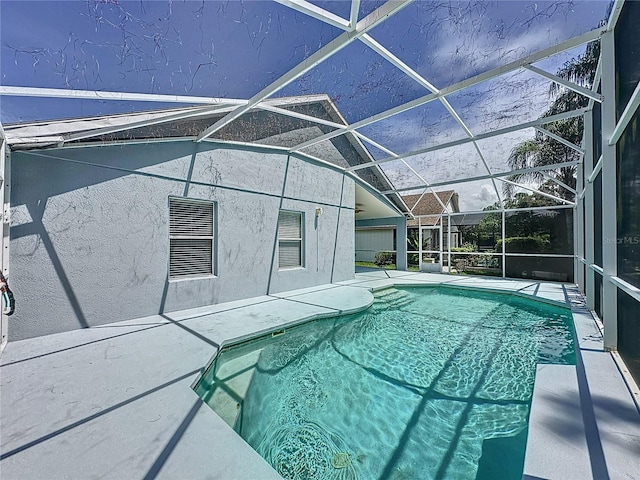 view of pool featuring a lanai and a patio area