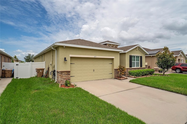 view of front of property with a front lawn and a garage