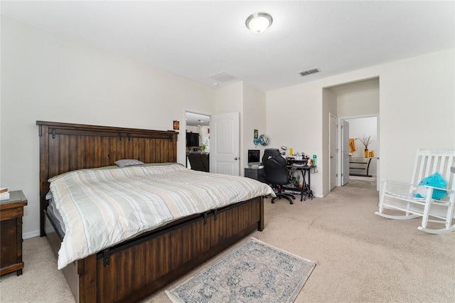 bedroom with light colored carpet