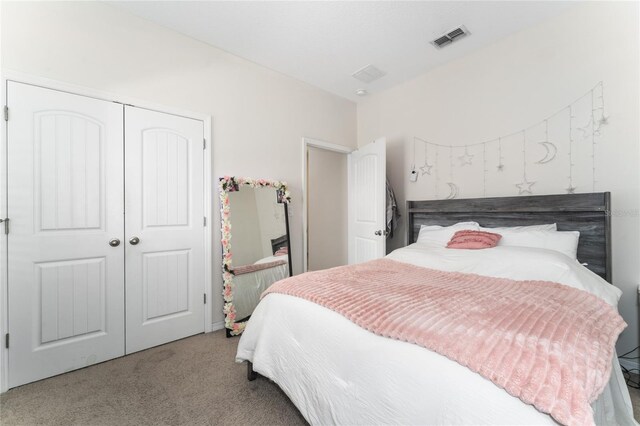 bedroom featuring a closet and carpet