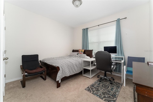 bedroom featuring light carpet