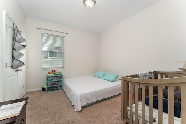 bedroom featuring light colored carpet