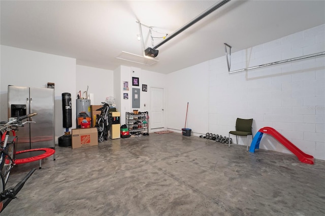 garage with electric panel, electric water heater, stainless steel fridge, and a garage door opener