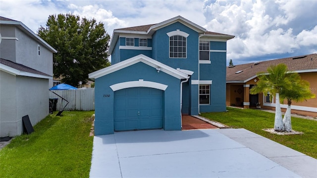 front facade featuring a garage and a front yard