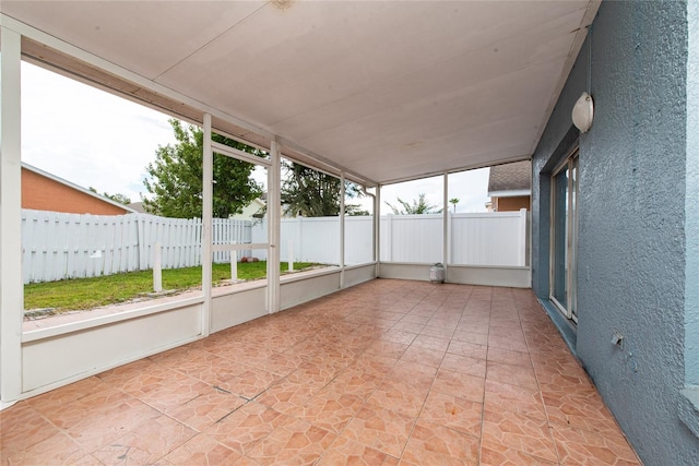 unfurnished sunroom featuring a healthy amount of sunlight