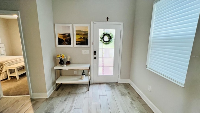 entrance foyer with light hardwood / wood-style flooring